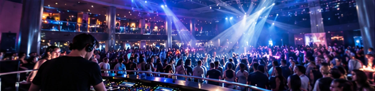 DJ and guests at a busy casino resort nightclub